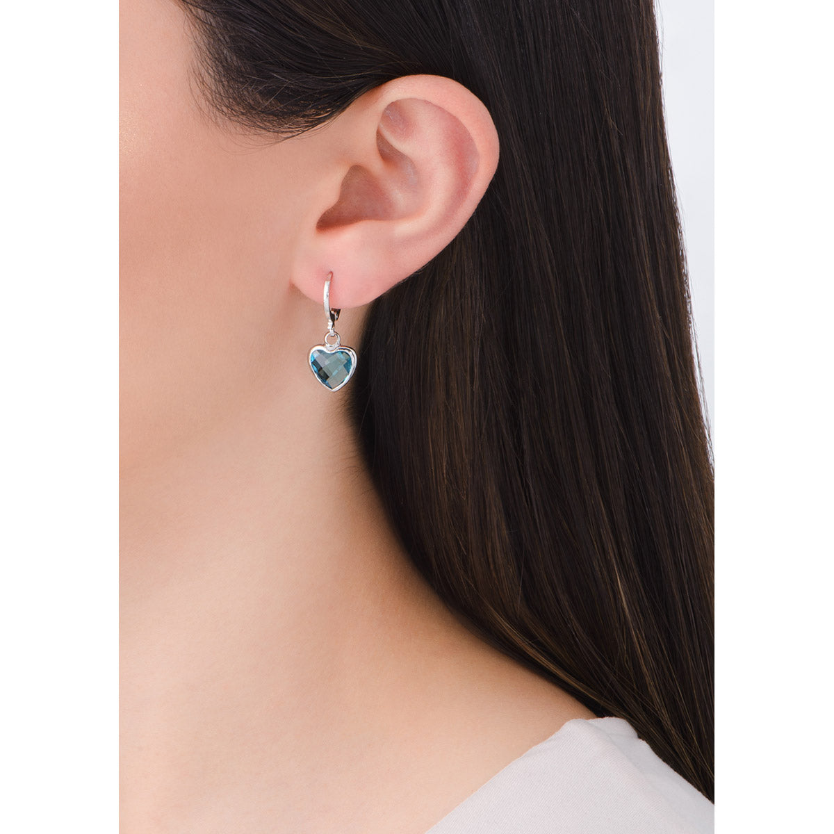 Aretes de platino con piedra azul celeste diseño circular