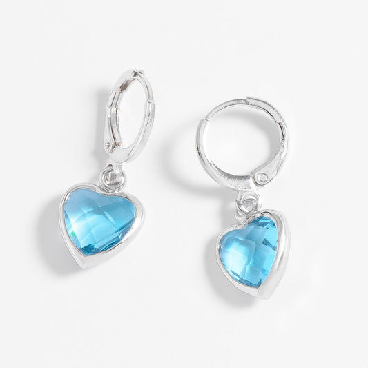 Aretes de platino con piedra azul celeste diseño circular