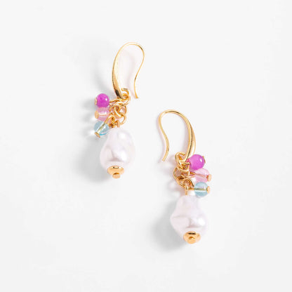 Anillo en cobalto con diseño circular y perlas, cuentas en tonos rosa y aguamarina