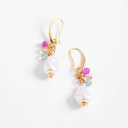 Anillo en cobalto con diseño circular y perlas, cuentas en tonos rosa y aguamarina