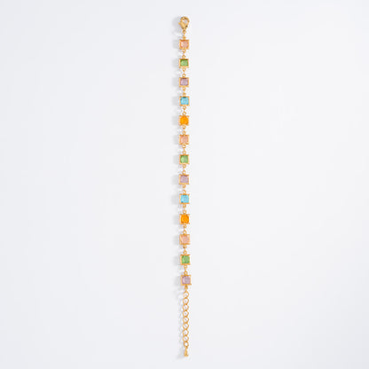Pulsera de baño de oro con piedras tonos rosa y azul