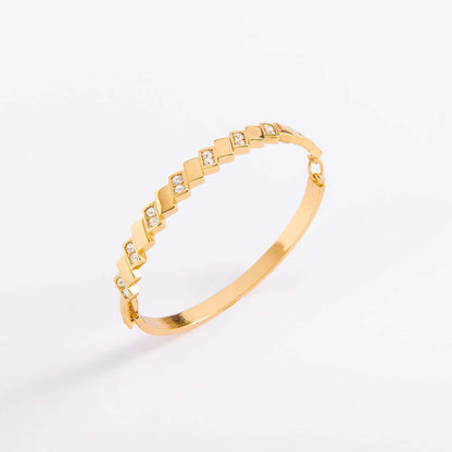 Brazalete en baño de oro y piedras en tono cristal