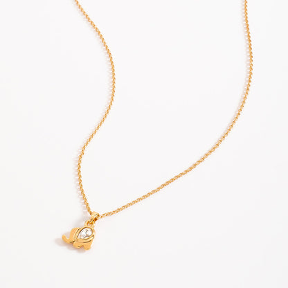 Collar con dije en baño de oro y piedra tono cristal