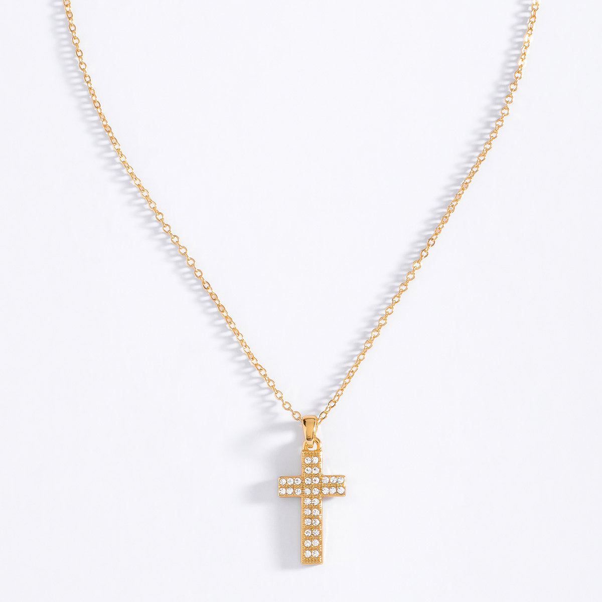 Collar de oro con dije de cruz y piedras cristal